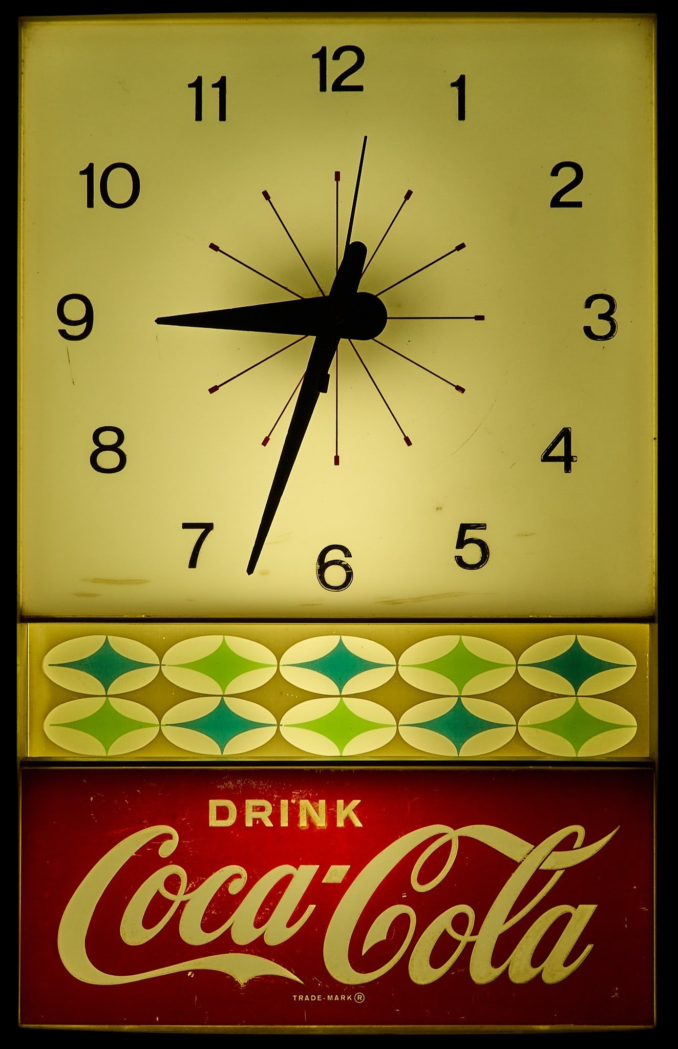 Vintage Coca-Cola Advertising Clock: Vintage mid-century lighted Coca-Cola advertising clock with atomic era design, circa 1950s-1960s, in working condition height 19.75 in. x width 12.75 in. x 4.25 in. Provenance: Property from a