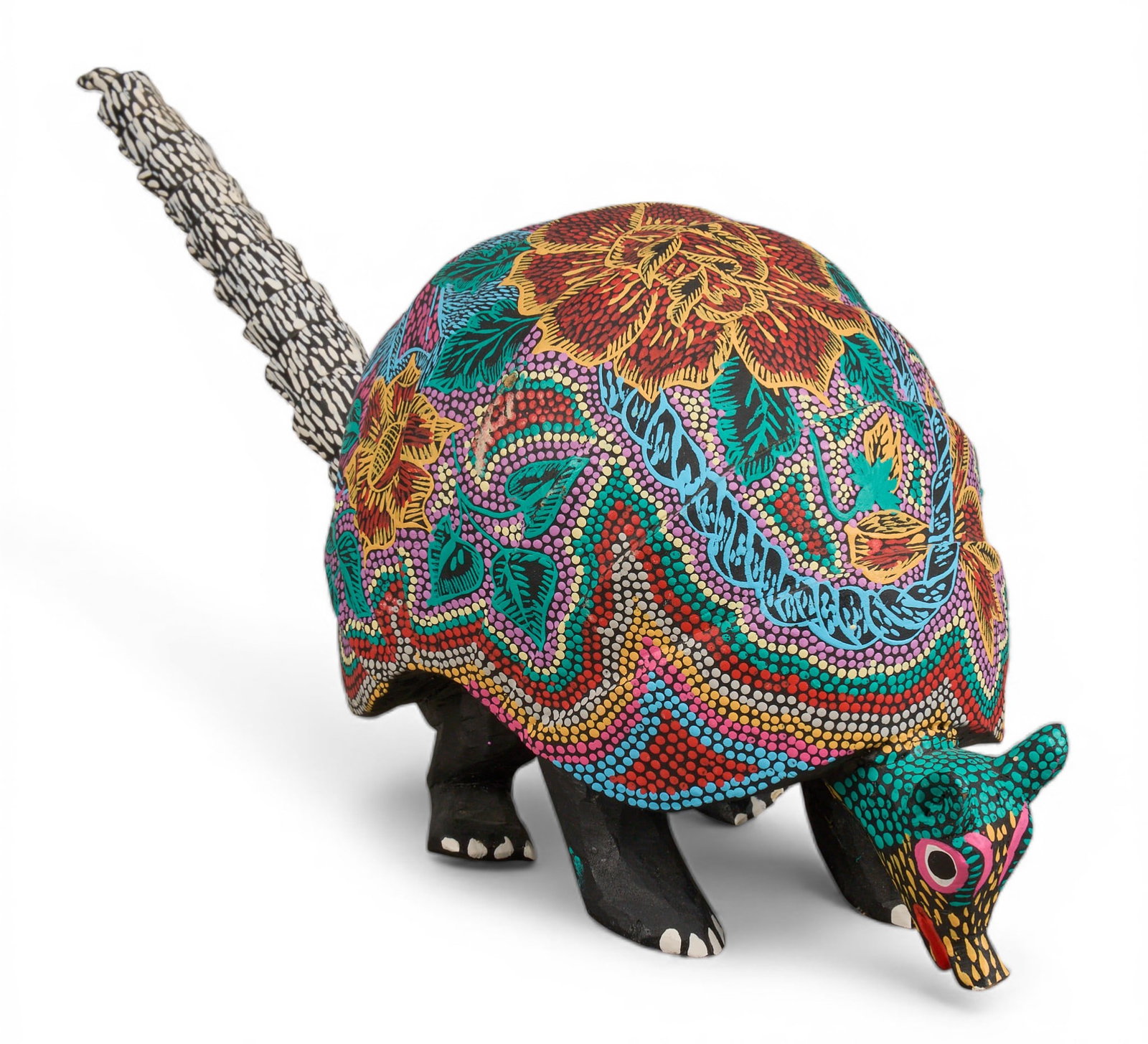 Alebrije Armadillo Sculpture: Hand-carved wooden Mexican folk art armadillo, hand-painted details height 6 in. x width 5 in. x depth 15 in. Provenance: Property from a home in Hollywood Park, Texas 