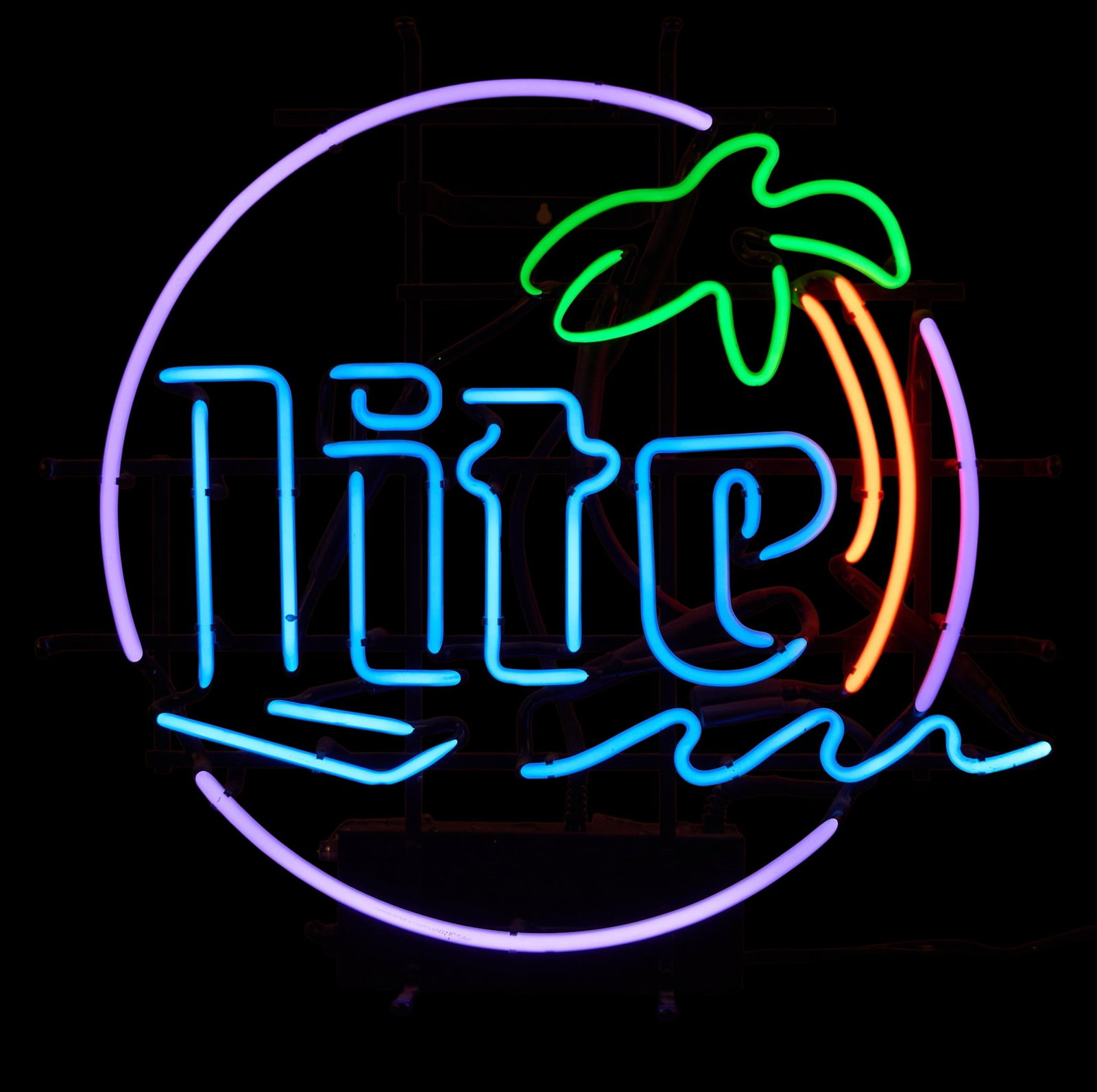 Miller Lite Neon Sign: Miller Lite beer neon sign with palm tree motif height 23 in. x width 23 in. x depth 6.5 in. Provenance: Property from a home in a San Antonio, Texas
