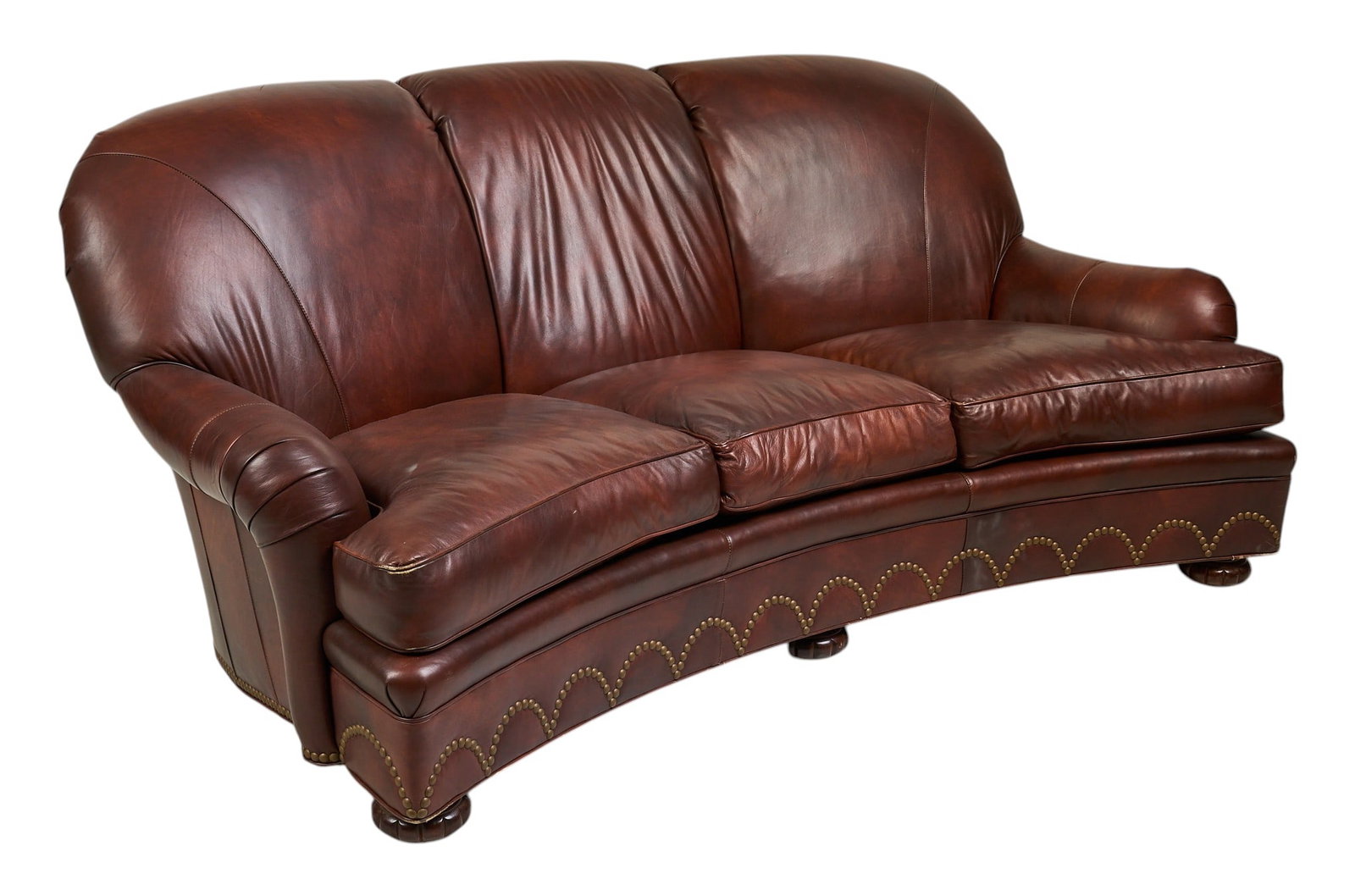Hancock & Moore Brown Leather Three-Seater Sofa: Hancock & Moore brown leather three-seater sofa with curved silhouette, tufted detailing along the base, and carved wooden feet, marked with label height 39 in. x width 87 in. x depth 51 in.&