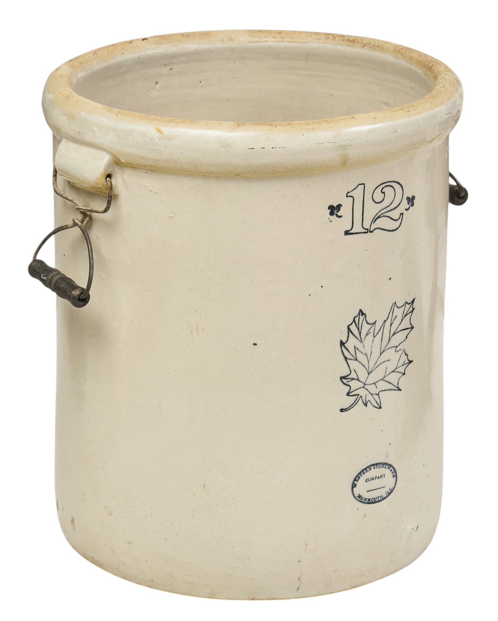 Western Stoneware 12 Gallon Crock: Western Stoneware (Monmouth, Illinois) twelve gallon stoneware crock, cobalt blue maker's mark, with metal handles height 19 in. x width 19 in. x depth 16 in. Provenance: Property from a home in