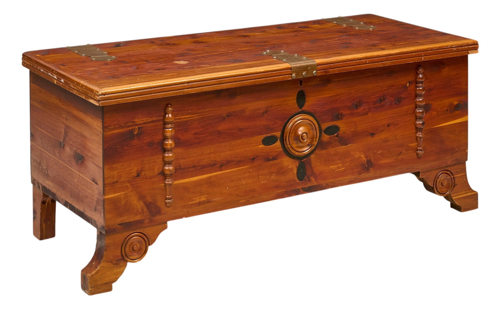 Cedar Chest: Cedar chest with hinged lid and brass hardware, featuring turned details and carved legs height 19 in. x width 45 in. x depth 20 in. Provenance: Property from the Estate of Robert A.