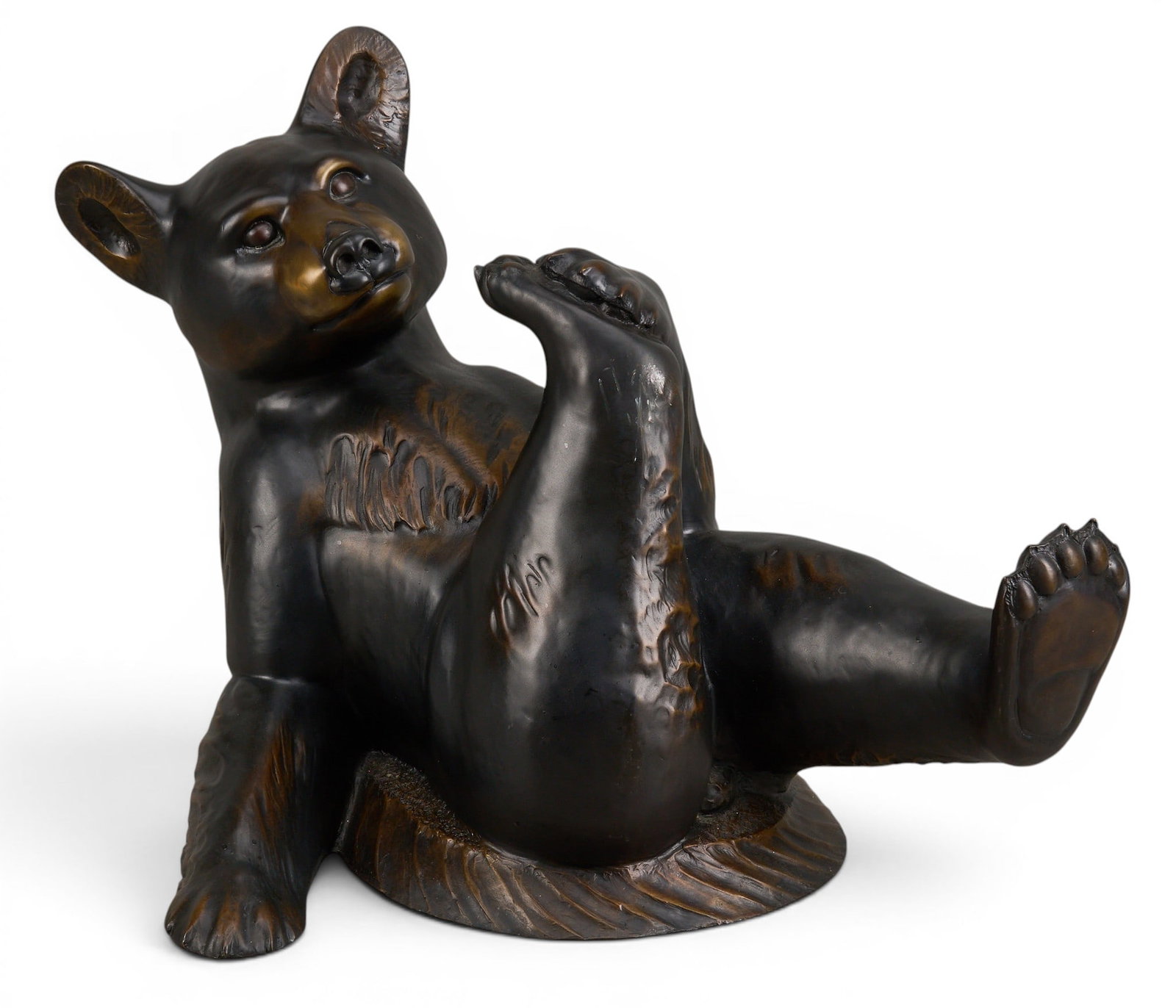 Robert Ball, Reclining Bear Bronze: Robert Ball (Amer., b. 20th C.), freestanding frolicking bear cub sculpture, artist-cast bronze, incised signature and edition number 2/47 height 16 in. x width 24 in. x depth 17 in. Provenance: