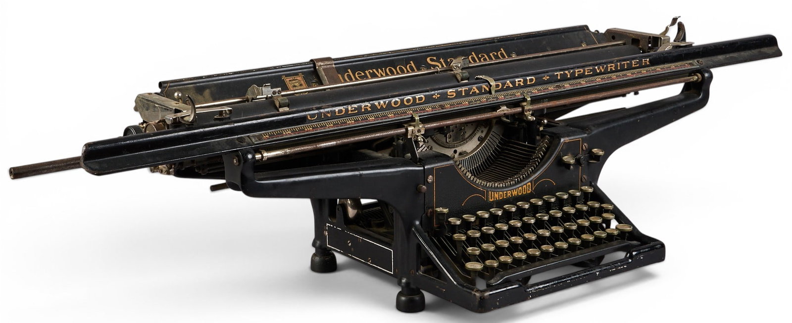Antique Underwood Standard Typewriter: Antique Underwood Standard model no. 3 typewriter, featuring wide metal carriage, gold-toned lettering on black enamel height 10 in. x width 41 in. x depth 13 in. Provenance: Property from a home in