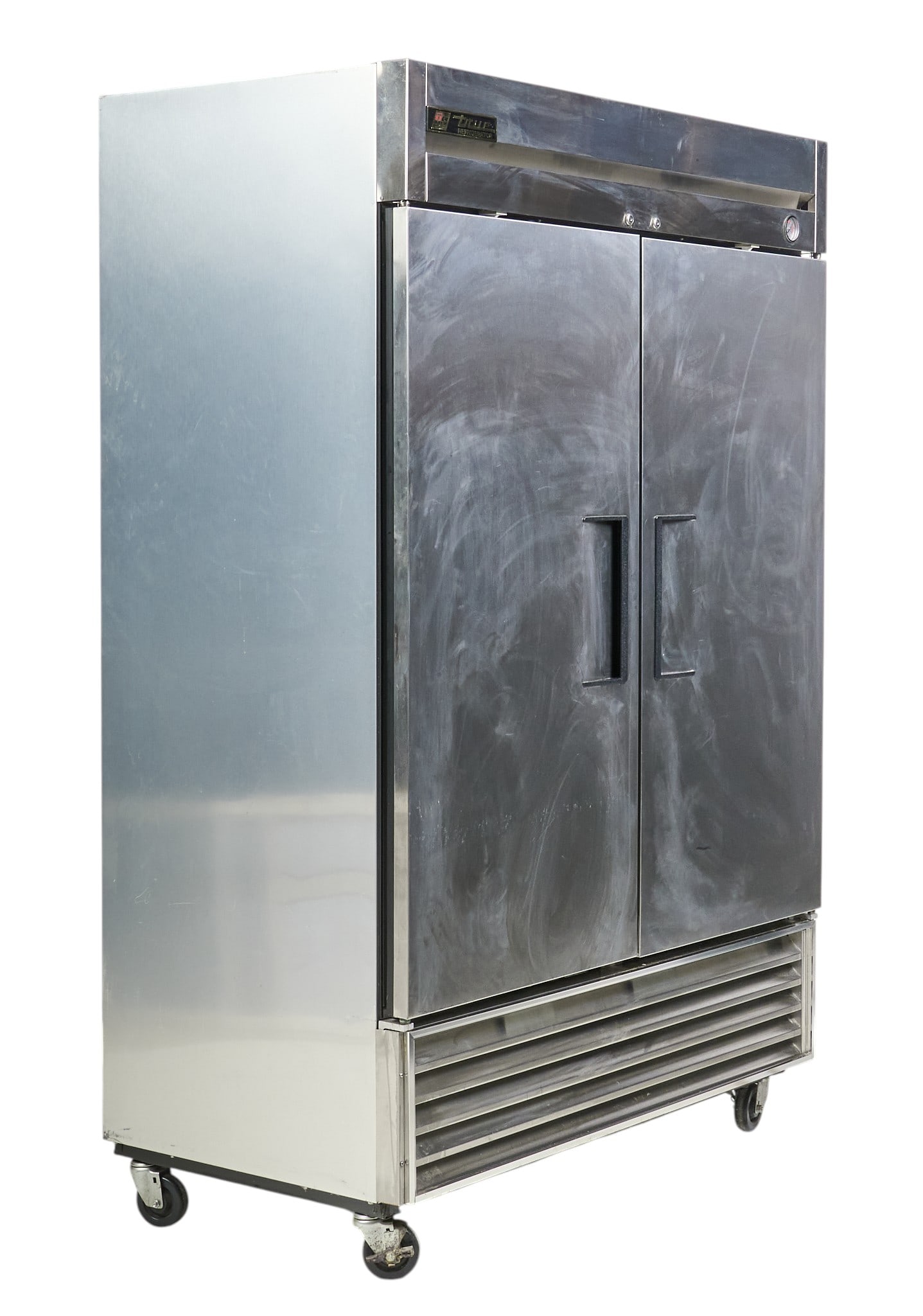 True Manufacturing Co. Double Door Stainless Steel Refrigerator: True Manufacturing Co. commercial double-door refrigerator with stainless steel construction, mounted on casters for mobility, in working condition height 83 in. x width 54 in. x depth 29.5 in. Proven