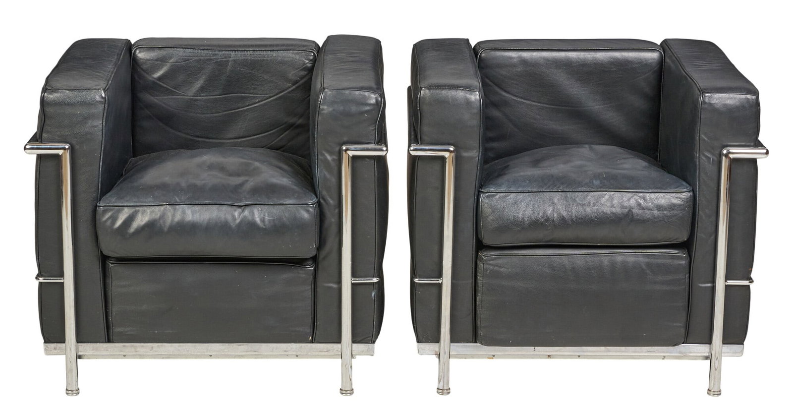Pair of Danish Cassina Style Mid-Century Chairs: Pair of Danish mid-century chairs in the style of Cassina model by Le Corbusier, with black leather seats and chrome frames height 26 in. x width 30 in. x depth 27.5 in. / each 