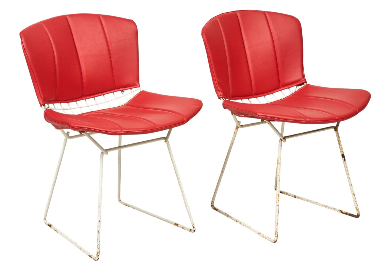 After Harry Bertoia, Pair of Side Chairs: After Harry Bertoia (Italy, 1915–1978) for Knoll, pair of side table with white painted metal frames featuring mesh design, and removable red upholstered seat and back cushions height 30