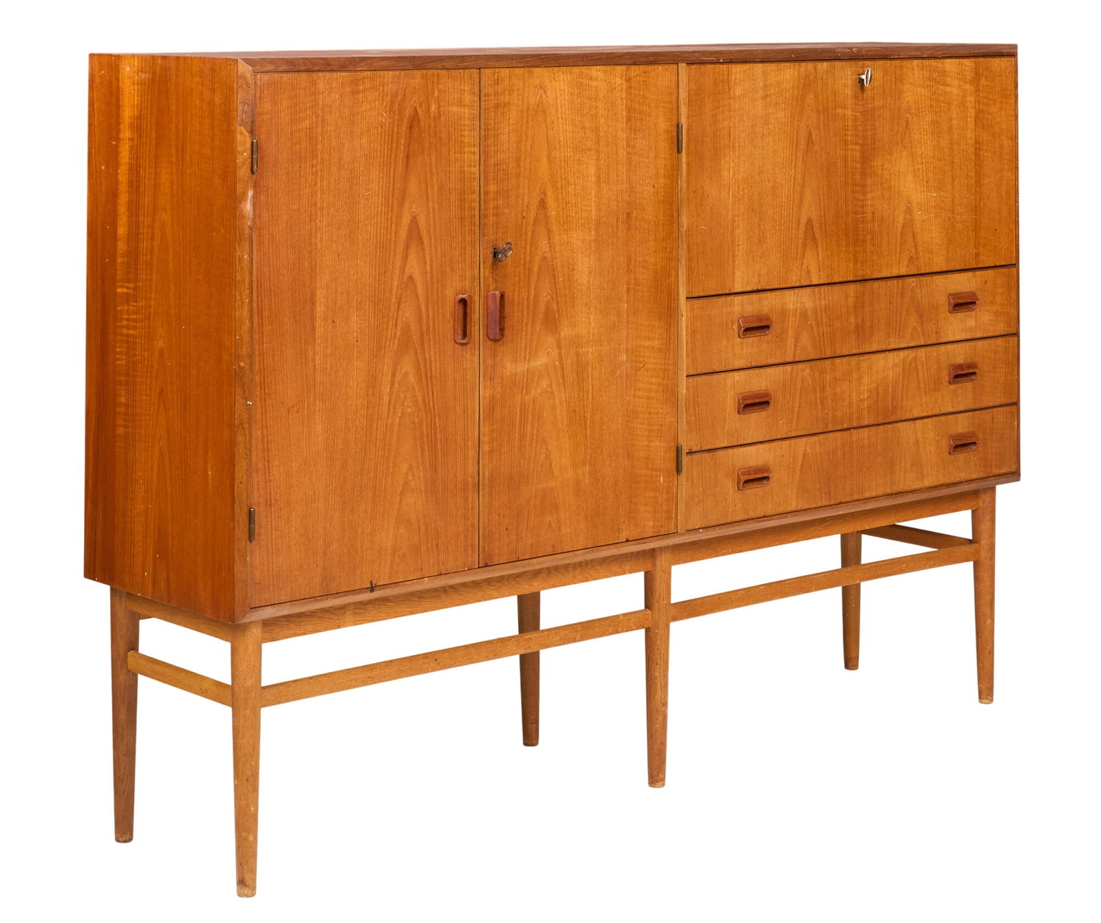 Danish Mid-Century Credenza: Danish mid-century credenza, with cabinet doors, drop-front cabinet, interior shelving, and drawers, on stretchered pin legs height 47.5 in. x with 68.5 in. x depth 16.5 in.