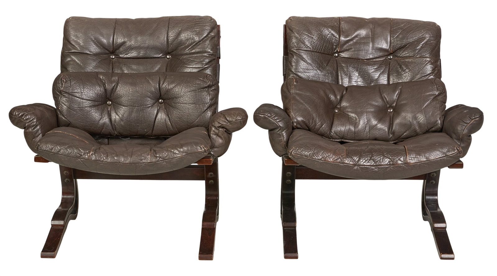 Pair of Danish Mid-Century Lounge Chairs: Pair o Danish mid-century lounge chairs, with button-tufted brown leather upholstery, on bent wood frames height 32 in. x width 35 in. x depth 34 in. / each