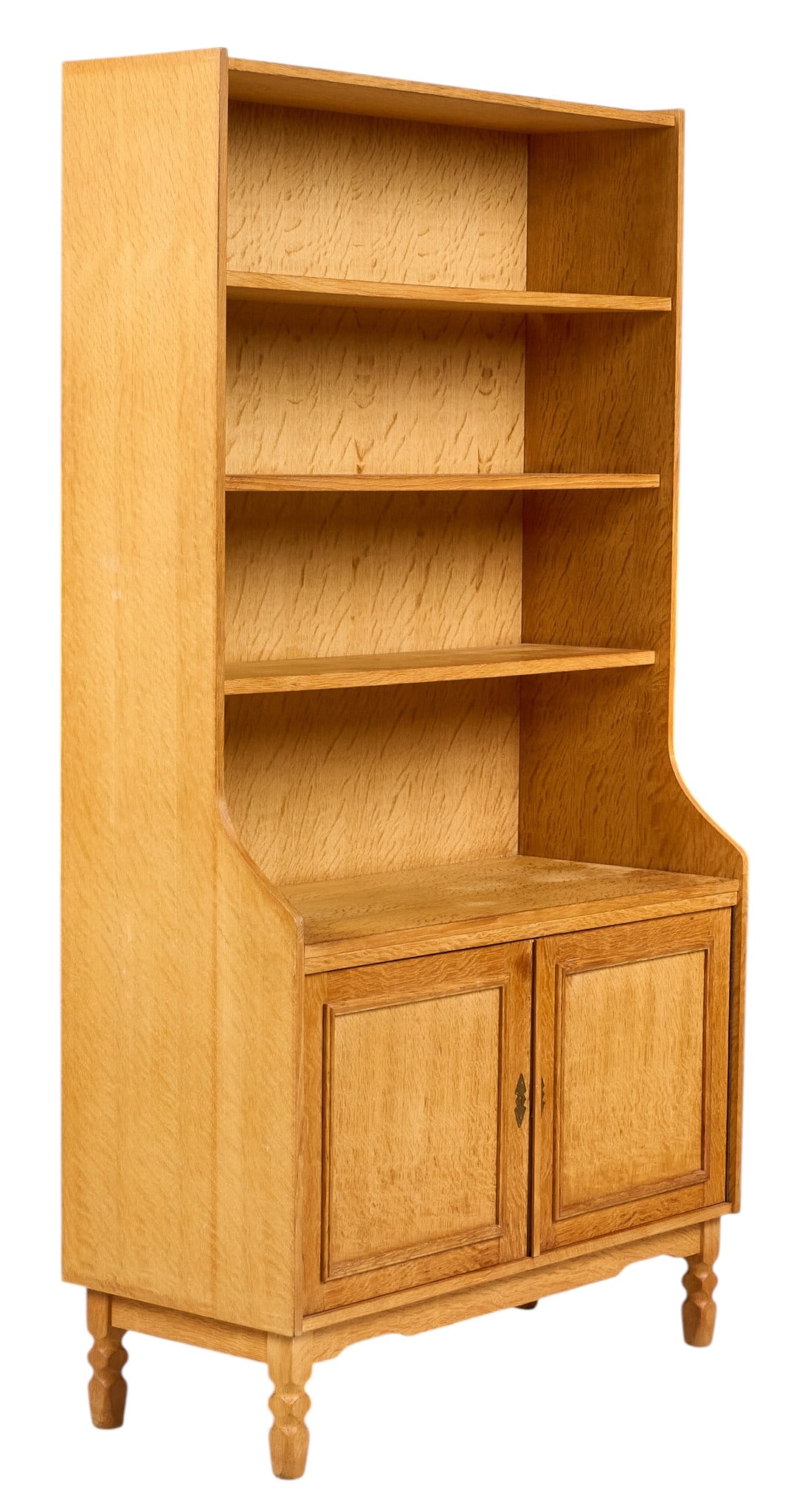 Henning Kjaernulf, Mid-Century Bookcase: Henning Kjaernulf (Denmark) mid-century bookcase with shelving and bottom cabinet, supported on faceted block legs height 72 in. x width 38.5 in. x depth 16.5 in. 