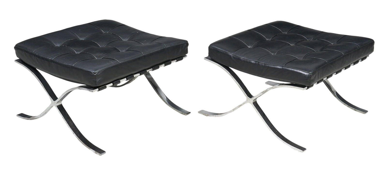Pair of Barcelona Ottomans: Pair of Barcelona ottomans, by Ludwig Mies van der Rohe (1886-1969, Kingdom of Prussia / Germany) for Alivar (Italy), featuring X-shaped chrome bases and black leather tufted cushions,