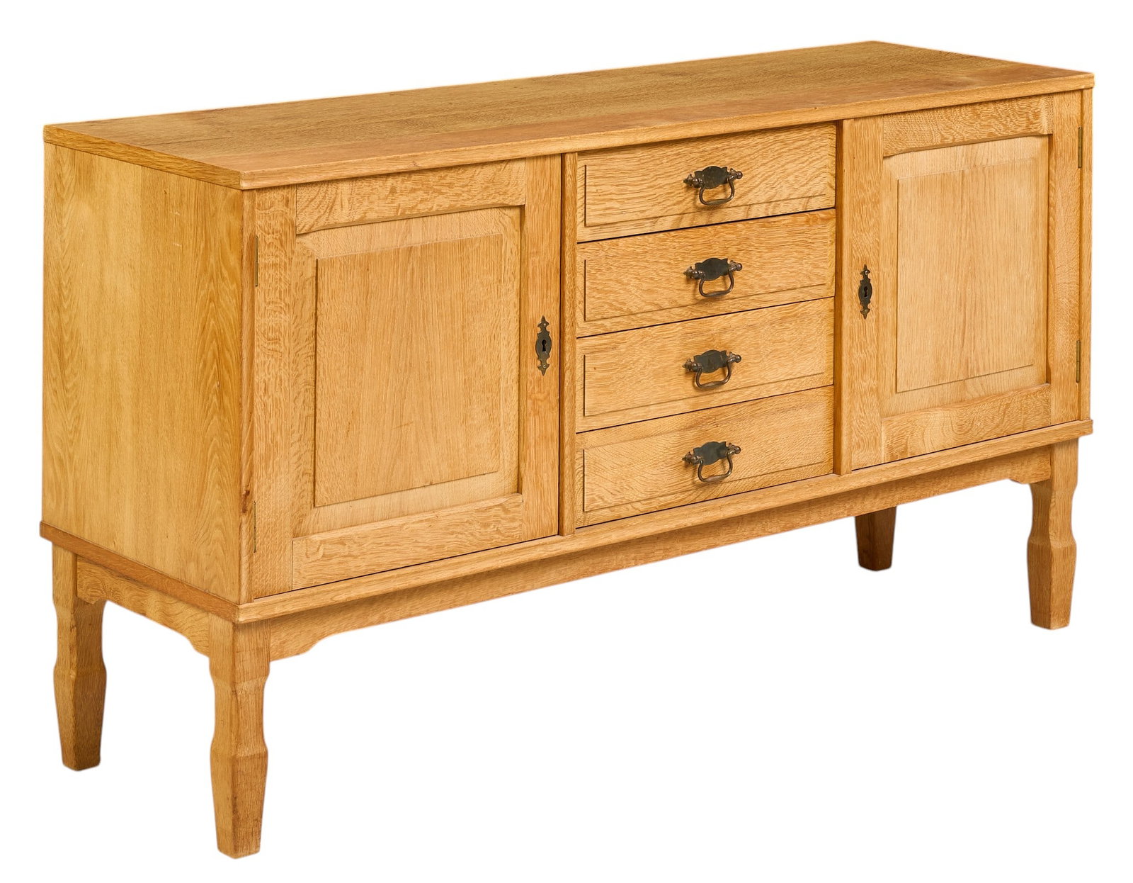 Henning Kjaernulf, Mid-Century Credenza: Henning Kjaernulf (Denmark) oak mid-century credenza with shelved cabinet storage and middle stack of drawers, supported on shaped legs height 29.5 in. x width 53 in. x depth 17 in. 