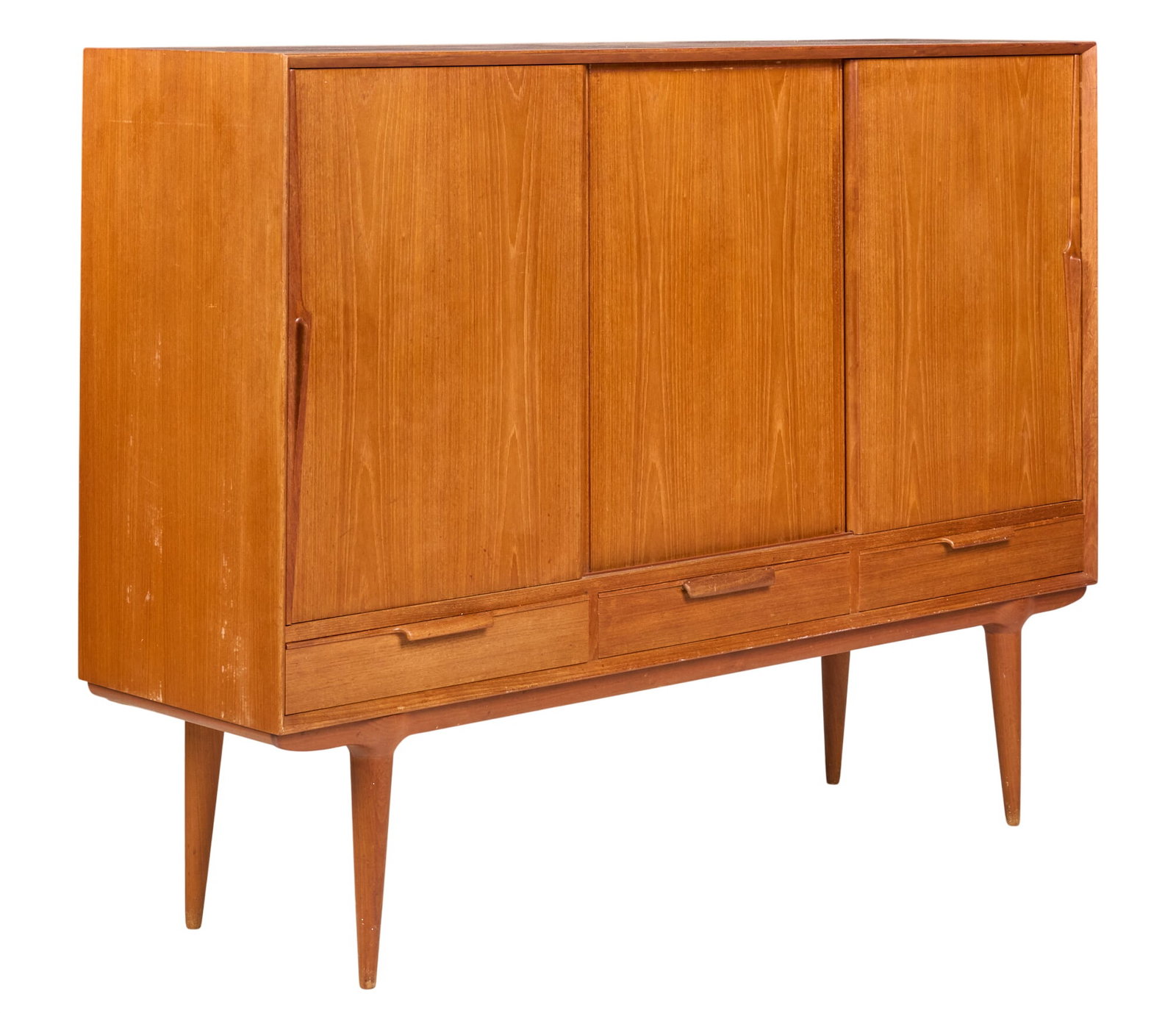 Danish Mid-Century Credenza: Danish mid-century credenza with three sliding cabinet doors, interior shelves, and lower drawers, supported on pin legs height 47.5 in. x width 63 in. x depth 18 in. 