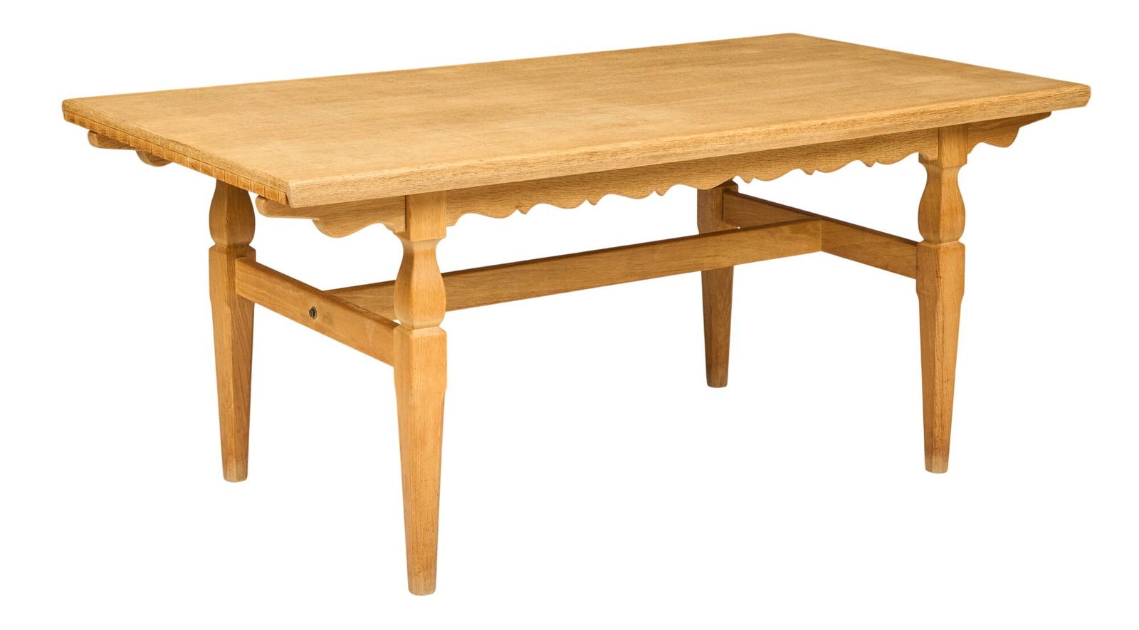 Henning Kjaernulf, Mid-Century Table: Henning Kjaernulf (Denmark) oak mid-century dining table with integrated leaves, supported on tapered legs height 29 in. x width 67 in. x depth 35 in. extended width 105.5 in. 
