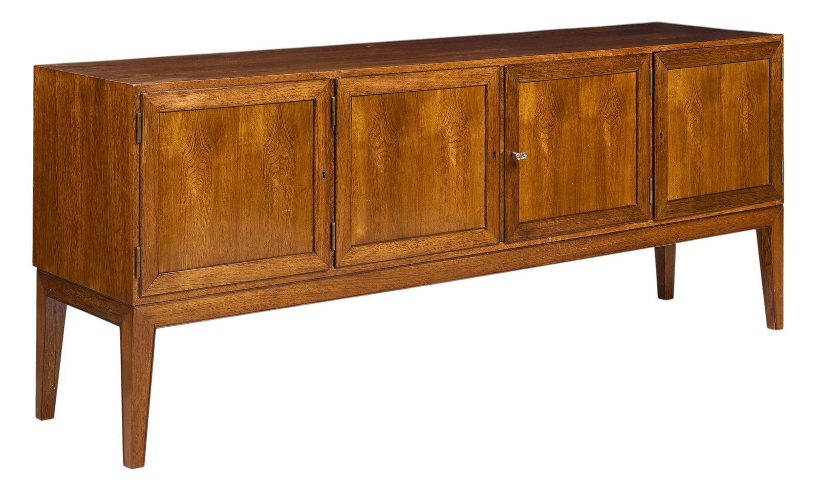 Danish Mid-Century Credenza: Danish mid-century credenza with four doors opening to shelved interior with flatware trays, supported on block legs height 31.5 in. x width 79 in. x depth 19 in. 