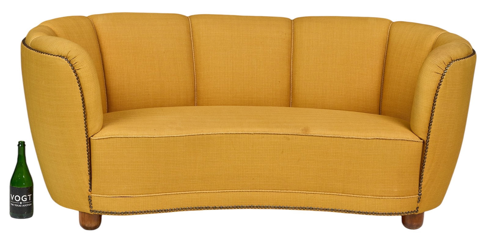 Danish Mid-Century Banana Sofa: Danish mid-century "banana" sofa with curved shape, channel-tufted back, and yellow fabric upholstery, supported on round block feet height 28.5 in. x width 67 in. x depth 34 in.