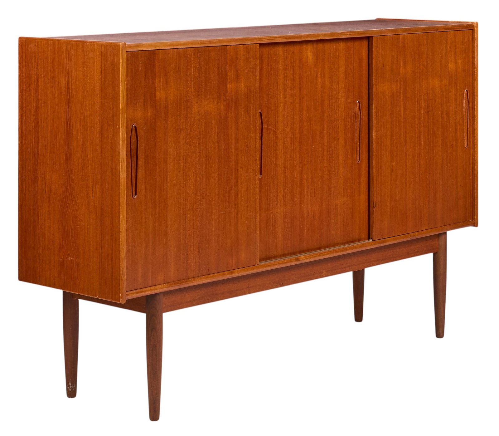 Danish Mid-Century Credenza: Danish mid-century credenza with three sliding doors opening to shelved interiors, supported on pin legs height 42 in. x width 65 in. x depth 17.5 in. 