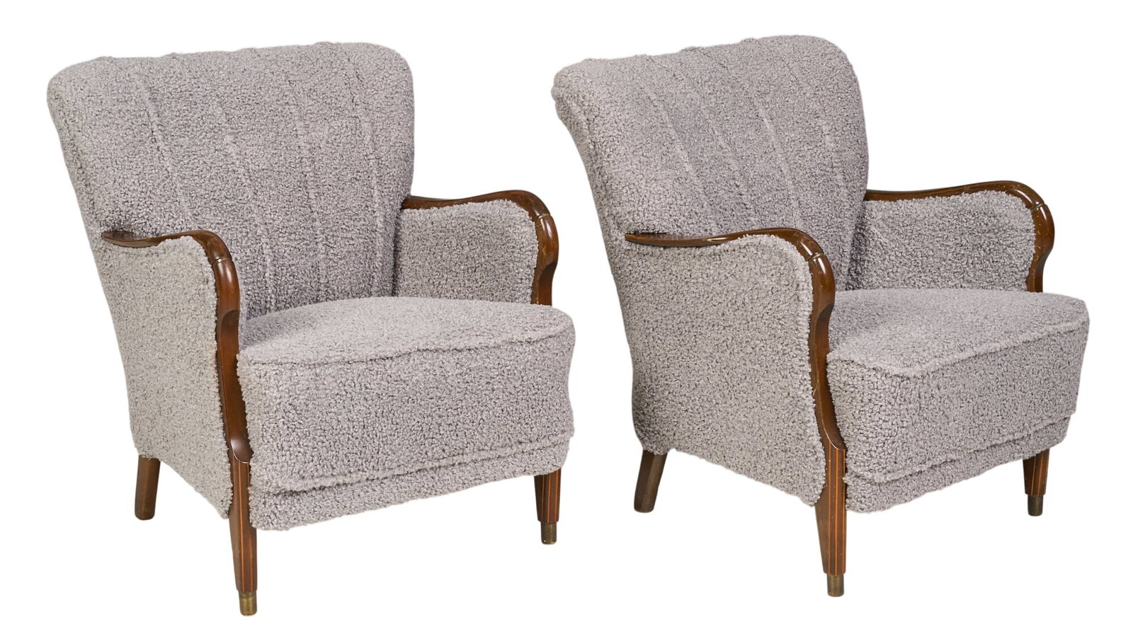 Pair of Danish Mid-Century Armchairs: Pair of Danish mid-century armchairs with boucle fabric upholstery, with serpentine armrests, and brass-capped wooden legs height 32 in. x width 29 in. x depth 26 in. 