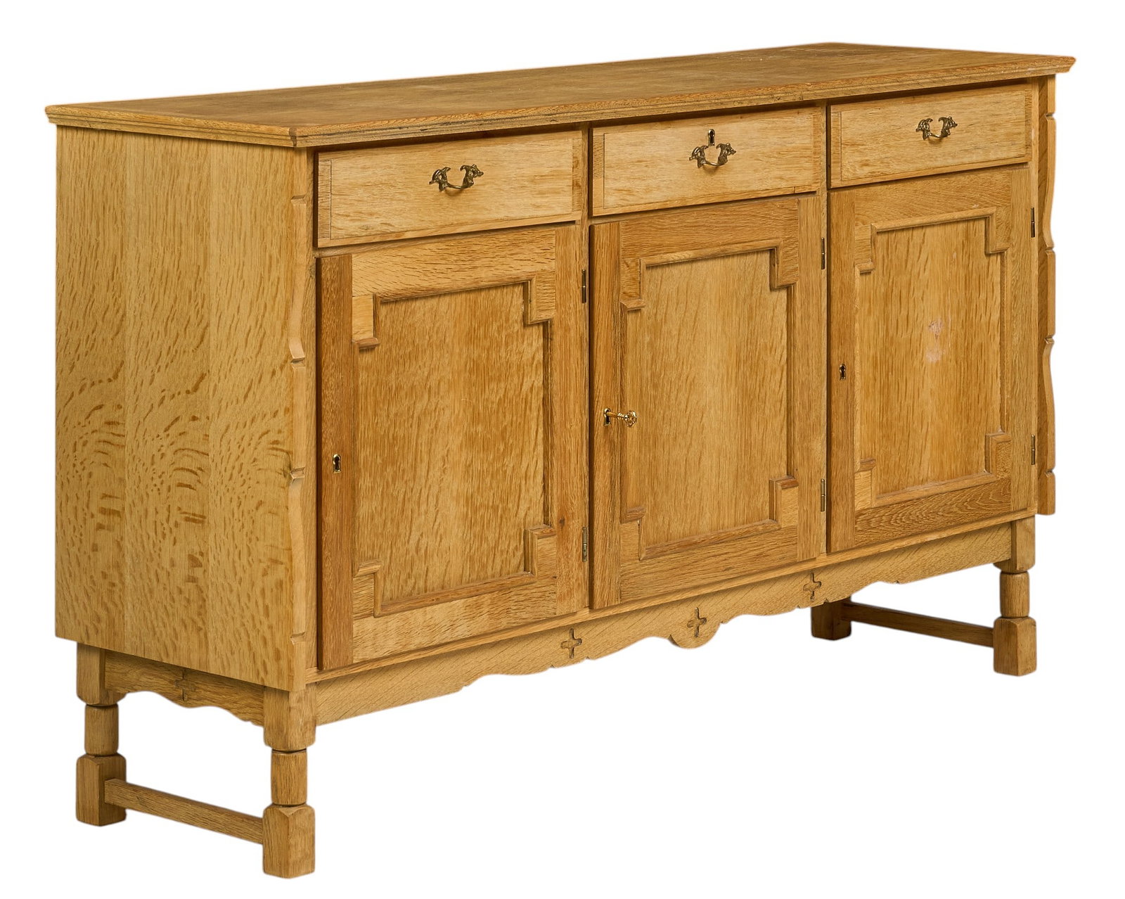 Henning Kjaernulf, Mid-Century Credenza: Henning Kjaernulf (Denmark) oak mid-century credenza with three drawers above three cabinets, each with single shelf, supported on block legs height 34 in. x width 59 in. x depth 19 in. 