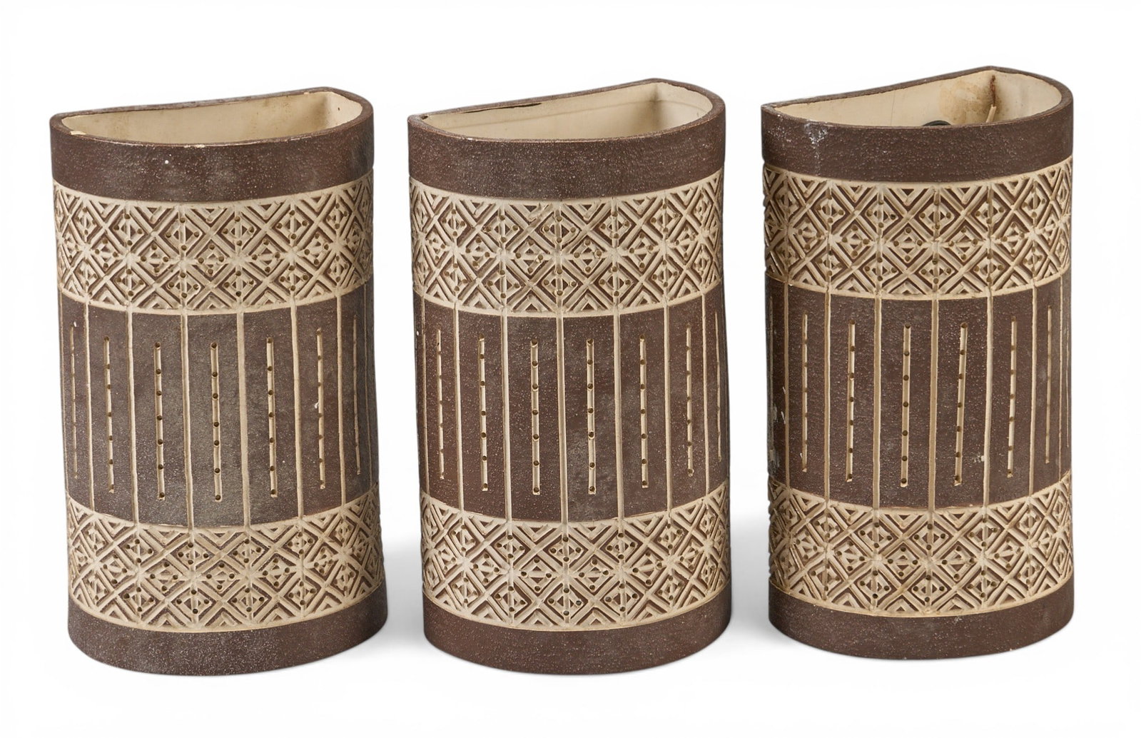 (3) Mid-Century Ceramic Wall Sconces: Three vintage ceramic wall sconces in the style of Beaumont Mood (San Antonio, Texas), signed "Paca" height 11.5 in. x width 7 in. x depth 5.5 in. / each Provenance: Property from a