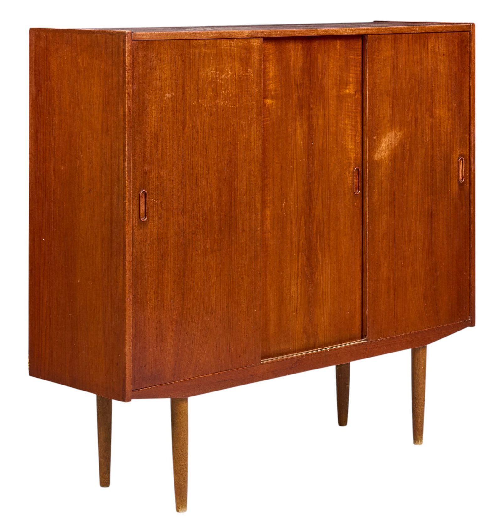 Danish Mid-Century Tall Credenza: Danish mid-century tall credenza with three sliding doors and divided interior storage with adjustable shelves, supported on pin legs height 48.5 in. x width 53 in. x depth 16 in. 