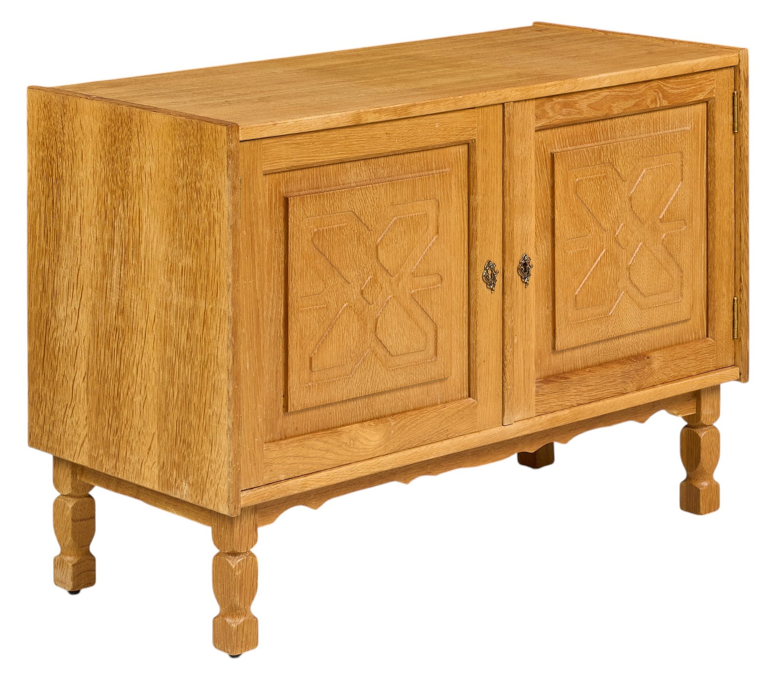 Henning Kjaernulf, Mid-Century Credenza: Henning Kjaernulf (Denmark) credenza with carved cabinet doors and interior shelf, supported on faceted block legs height 28 in. x width 39.5 in. x width 17.75 in. 