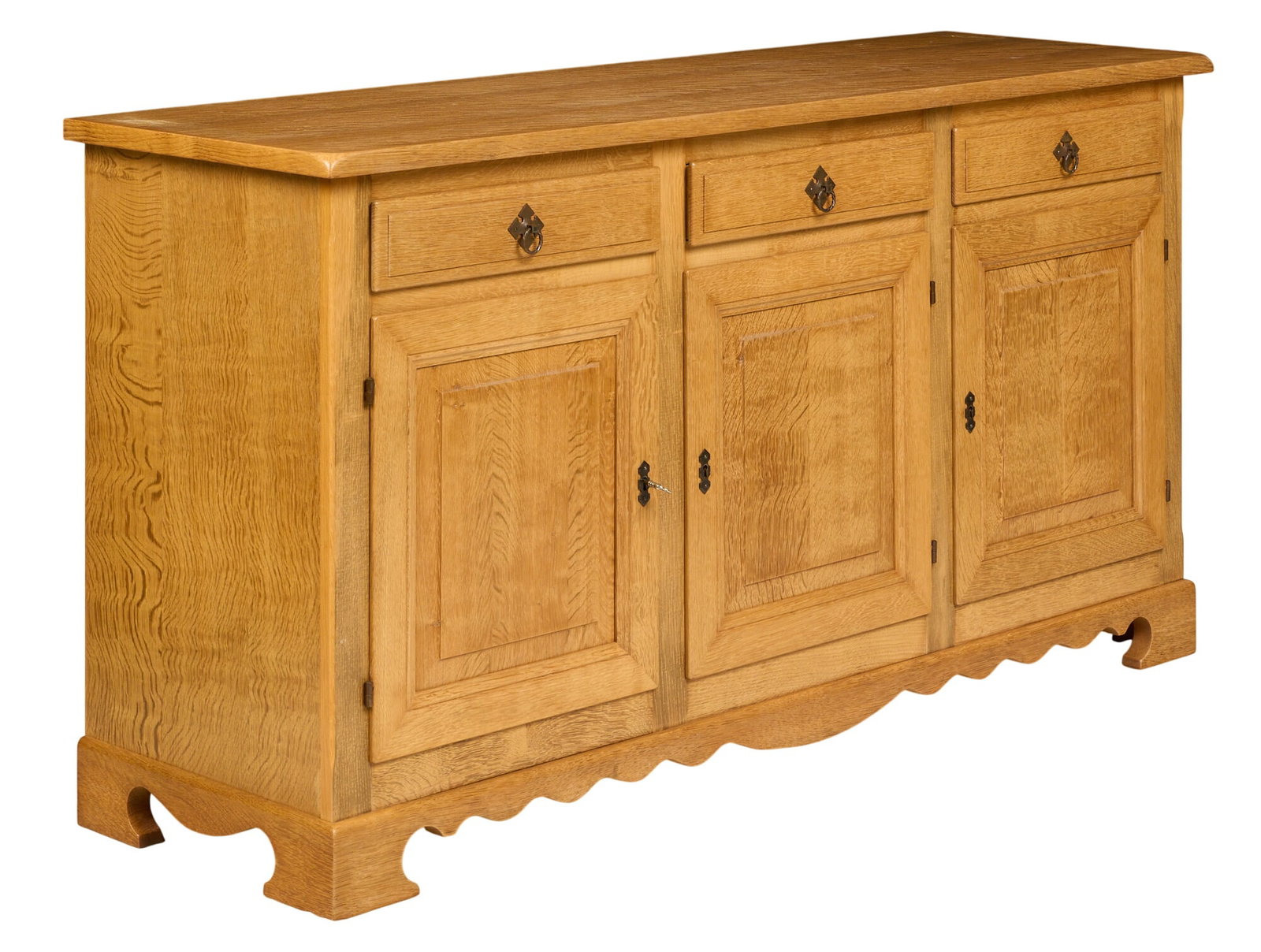 Danish Mid-Century Credenza: Danish mid-century credenza with three cabinet doors, interior shelving, and three drawers, on shaped block legs with serpentine design to base height 32 in. x width 60 in. x depth 19 in.