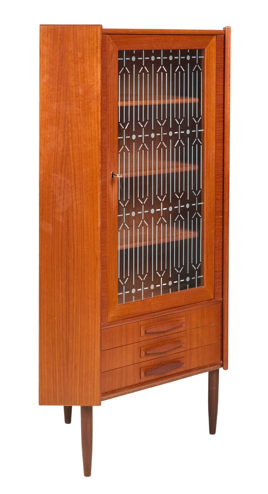 Danish Mid-Century Corner Cabinet: Danish mid-century corner cabinet with decorated glass front door, interior shelving, and bottom drawer storage, supported on pin legs height 57.5 in. x width 35.5 in. x depth 22 in. 