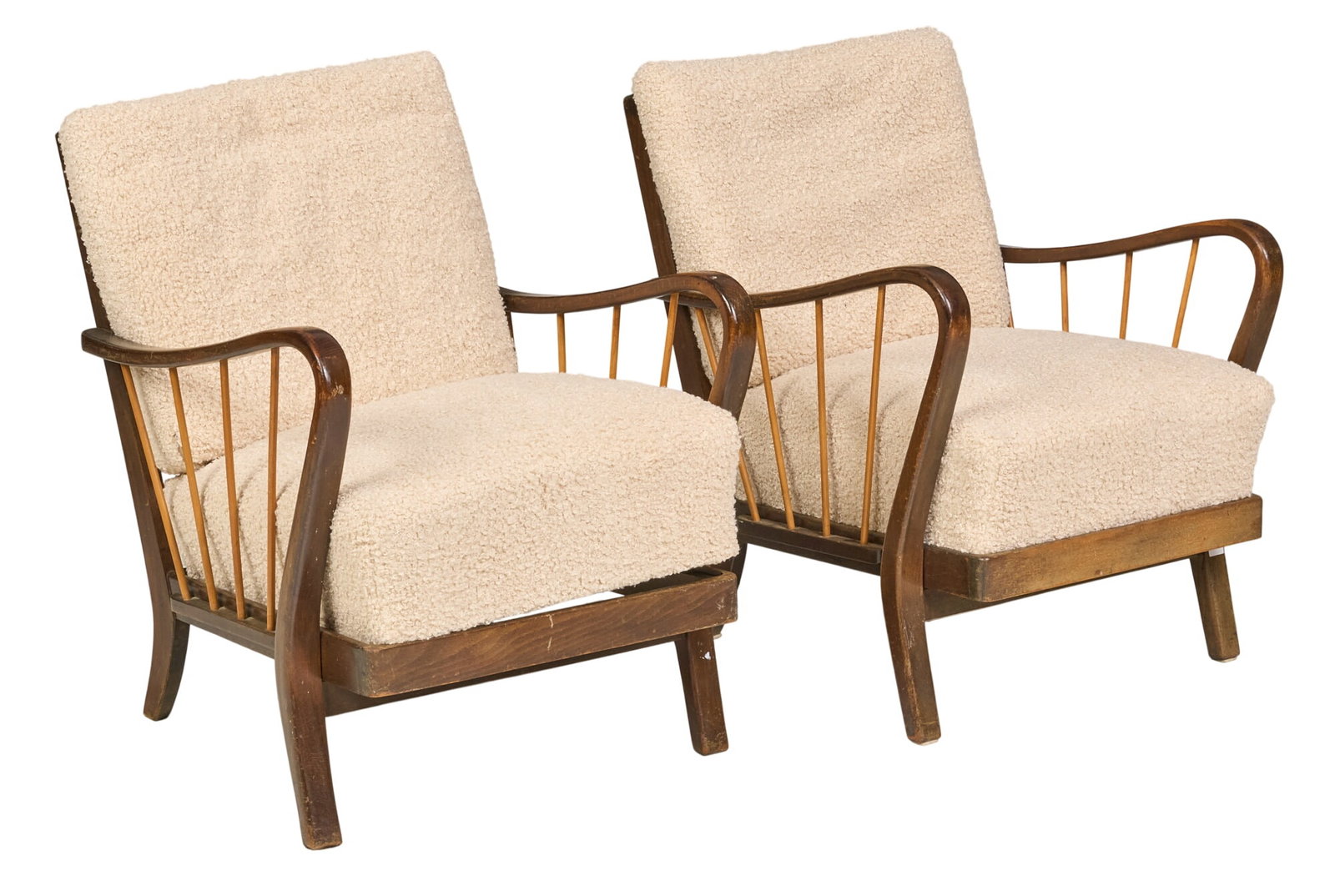 Pair of Danish Mid-Century Armchairs: Matched pair of Danish mid-century upholstered armchairs, each with walnut frame with spindle-form sides and cream boucle upholstery height 31 in. x width 24 in. x depth 29 in.