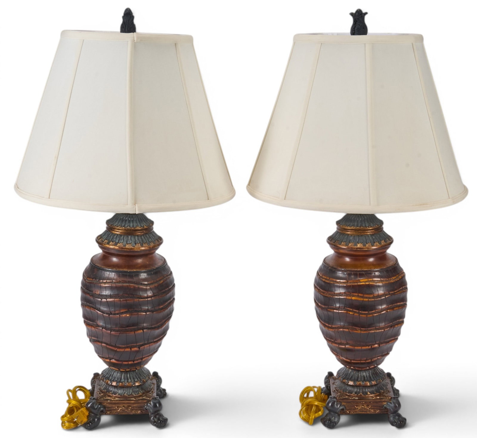 Pair of Privilege International Lamps: Pair of table lamps by Privilege International, featuring leather-wrapped bodies, and supported by four ornate feet, topped with cream-colored shades height 30 in. x diameter 16 in. / each
