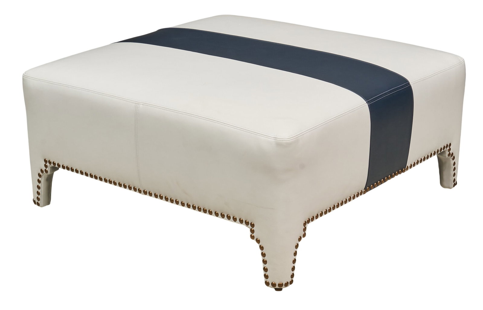 Barclay Butera Sheffield Cocktail Ottoman: Barclay Butera Sheffield cocktail ottoman with white leather body with a navy blue stripe and old brass nailhead trim height 19 in. x width 43.5 in. x depth 43 in. Provenance: Property from a