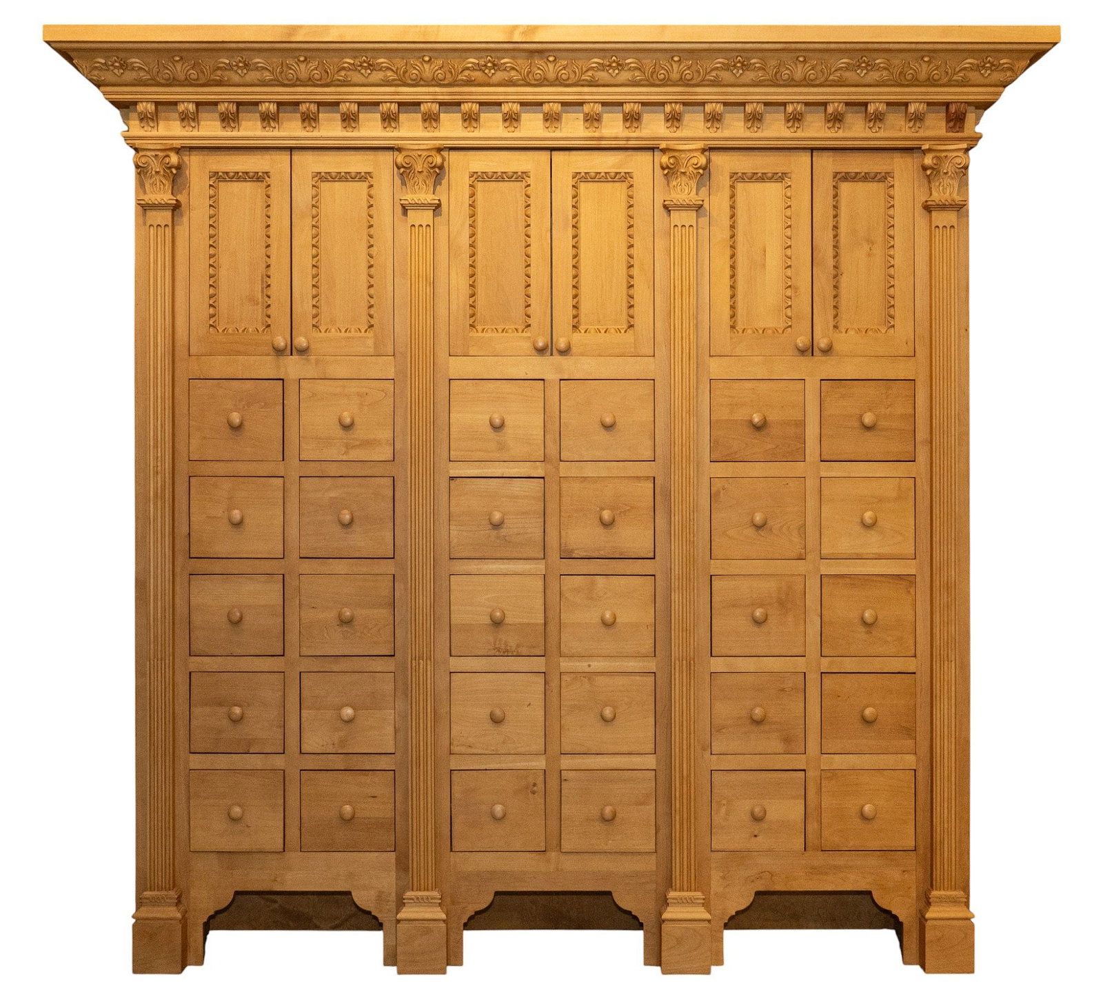 Apothecary Cabinet: Custom made seven-foot-tall apothecary cabinet with carved crown, and corbels, three pairs of doors that open to interior storage, and thirty drawers flanked with fluted pilaster accents height 90