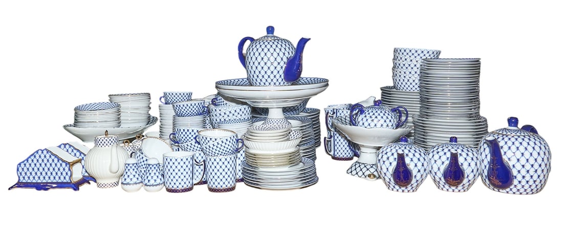 Large Set of Lomonosov Porcelain: Large set of Lomonosov porcelain in the Cobalt net pattern, includes nut bowls, mugs, cereal bowls, creamers, sugar bowls, soup bowls, bread and butter plates, salad plates, teacups, napkin holders,