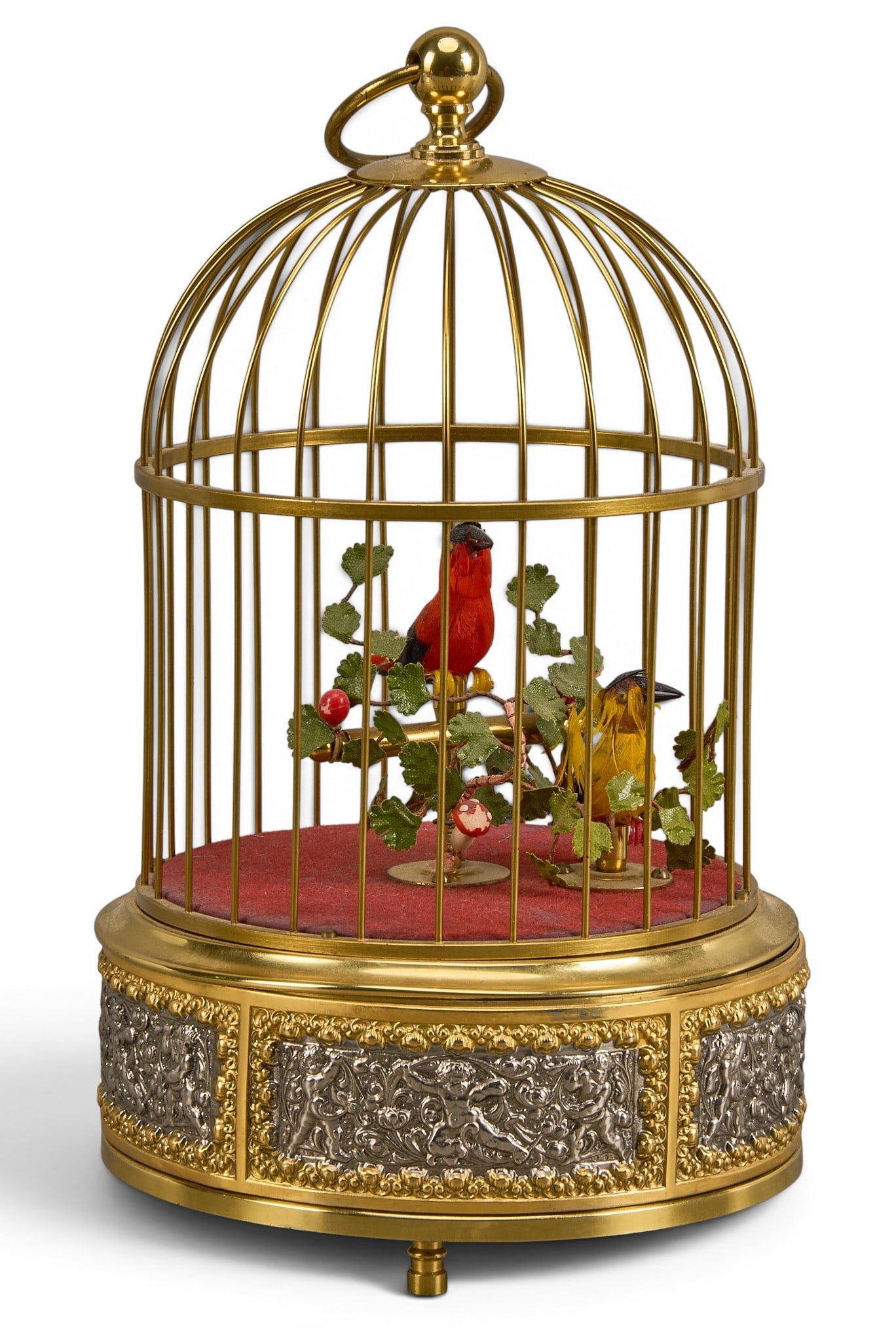 Antique German Bird Singing Automoton: Vintage German singing bird automoton in brass cage, with winding key and activity switch, in working condition, circa 1920 height 10 in. x width 5.5 diameter Provenance: Property from a home