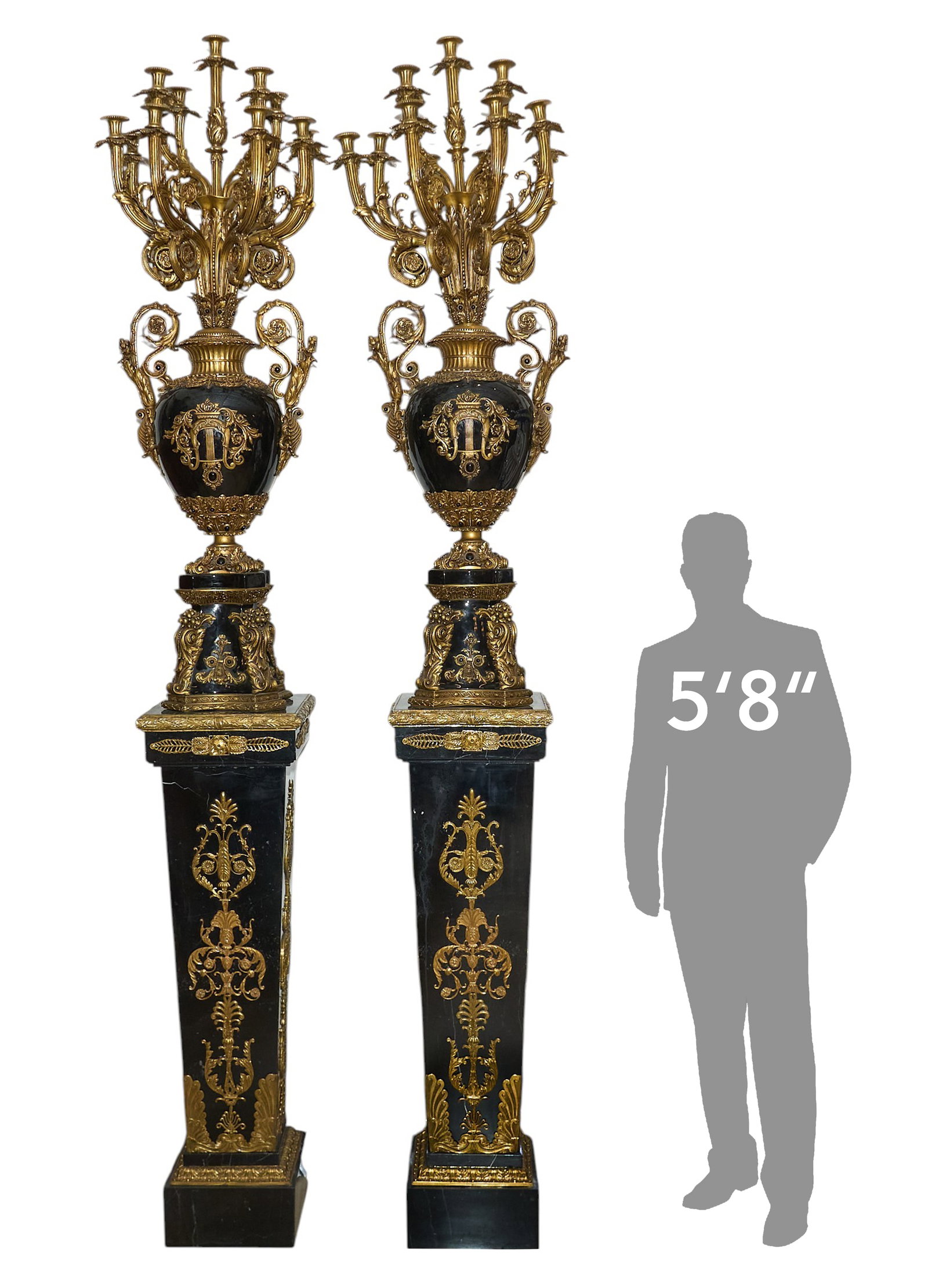 Pair of Monumental Candelabra: Pair of monumental Italian brass mounted black ceramic candelabra on black stone pedestal bases, in working condition height 112 in. x width 18 in. x depth 15 in. / each Provenance: