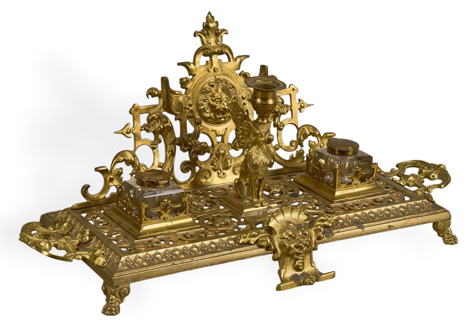 French Brass Inkwell: French brass ornate style inkwell with two glass ink pots height 9 in. x width 20 in. x depth 8 in. Provenance: Property from the personal collection of a noted San