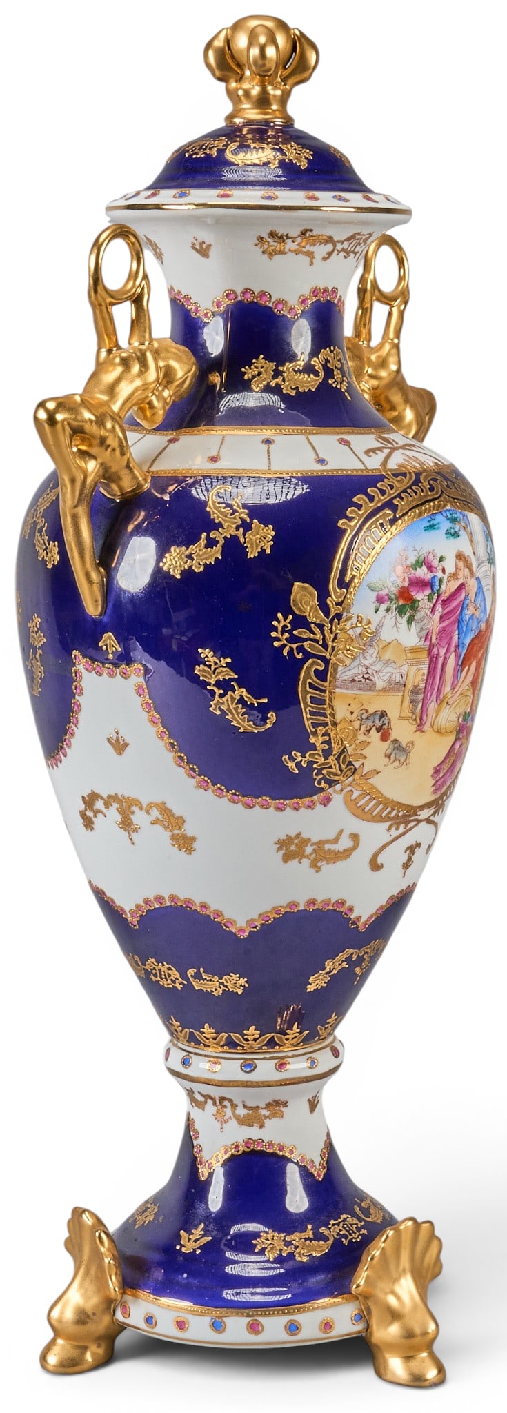 Limoges Porcelain Lidded Vase: Limoges porcelain lidded vase with cobalt blue finish, gilt detailing, and hand-painted scene height 22.5 in. x width 13 in. x depth 9 in. Provenance: Property from a home in San Antonio, Texas