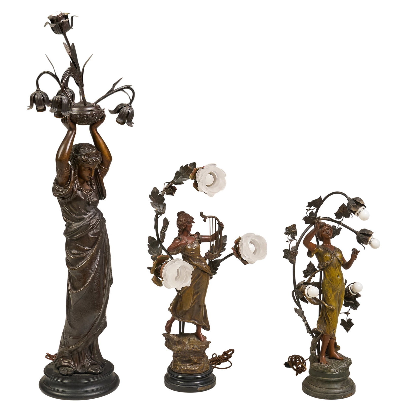 (3) Art Noveau Style Figural Lamp: Three Art Noveau style figural lamp set with floral and musical imagery height 50 in. x width 15 in. x depth 15 in / largest Provenance: Property from a home in Boerne, TX