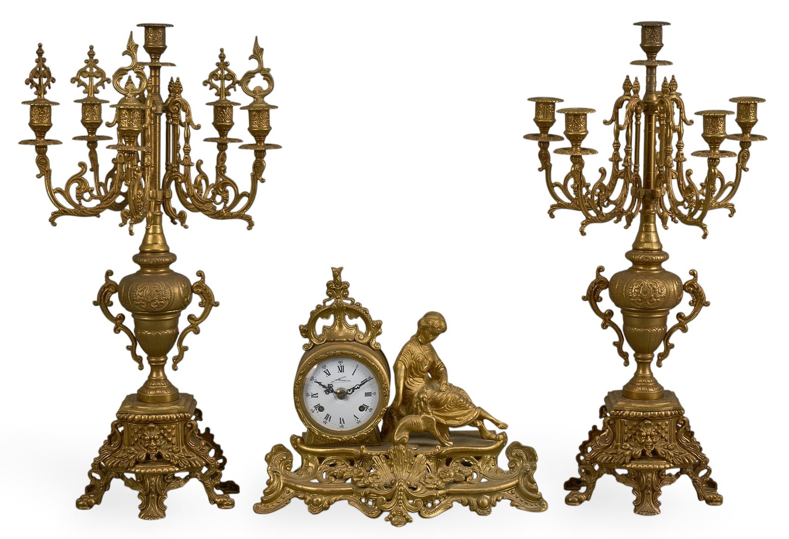 Vintage Garniture Set: Assembled mantel clock and candelabra garniture set height 24 in. x width 11.5 in. x depth 10.5 in. / candelabra Provenance: Property from a home in Yorktown Texas