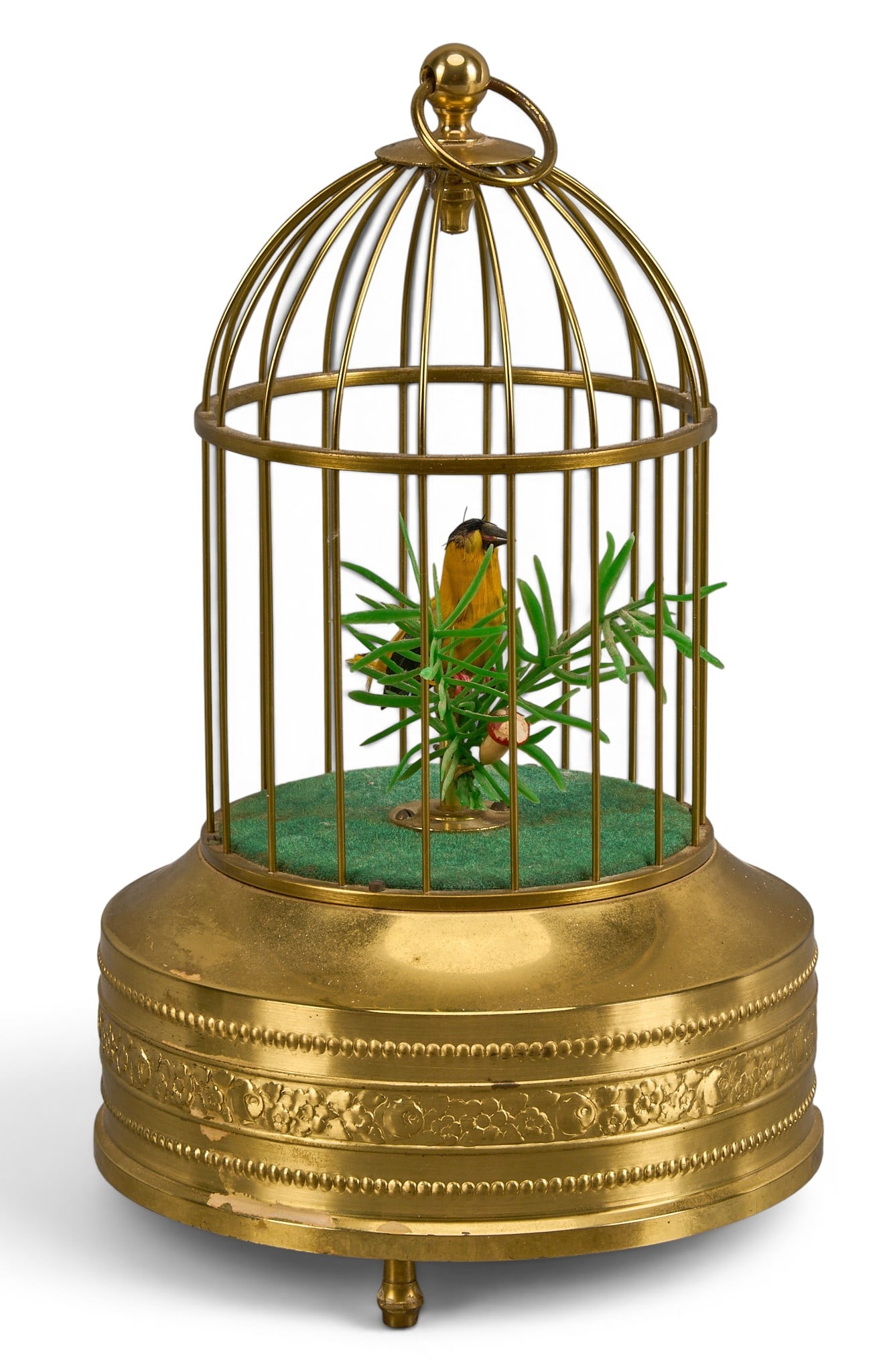 German Bird Singing Automaton: Vintage German singing bird automaton in brass cage, with winding key and activity switch, in working condition height 9.25 in. x width 5.25 diameter Provenance: Property from a home in