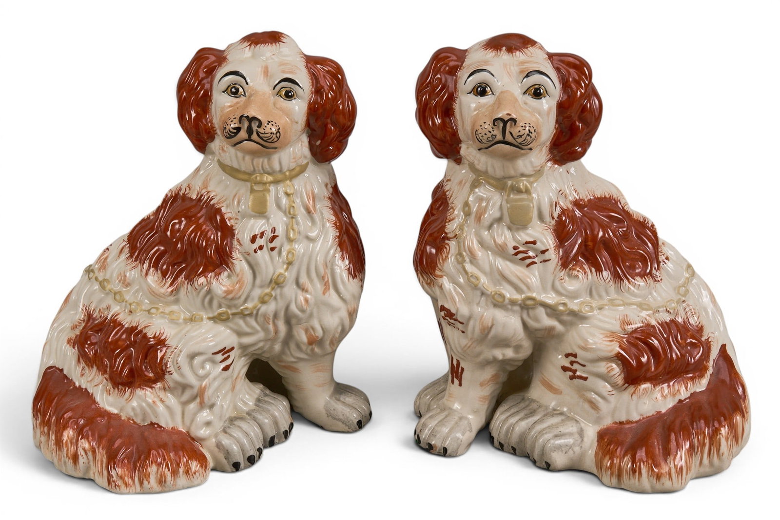 Pair of Staffordshire Porcelain Spaniels: Pair of Staffordshire porcelain spaniel dogs height 11 in. x width 9 in. x depth 7 in. / each Provenance: Property from a home in Chicago, Illinois