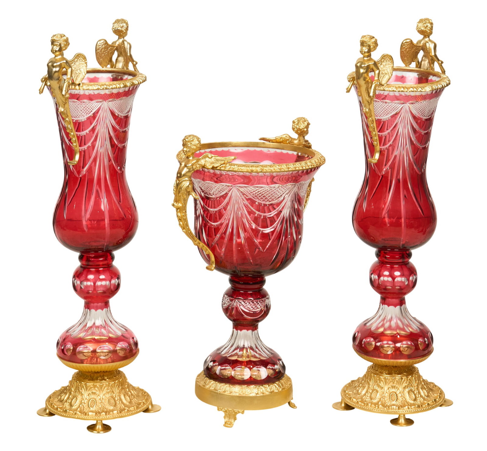 (3) Piece Cranberry Cut Crystal Set: Three-piece cranberry cut crystal vase garniture set with ormolu mountings height 31 in. x width 17 in. x depth 12 in. / largest Provenance: Property from the Estate of Robert A.