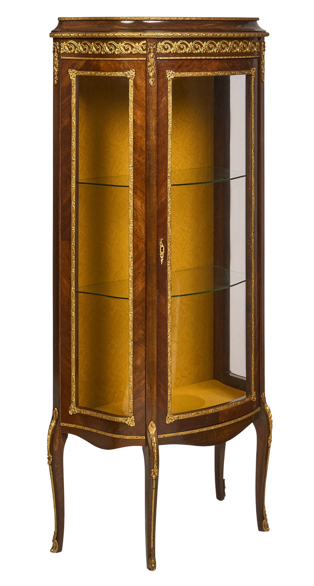 Vintage French Vitrine: Vintage French glass-front vitrine with glass shelves and mountings height 58 in. x width 28 in. x depth 14 in. Provenance: Property from a home in Helotes, Texas