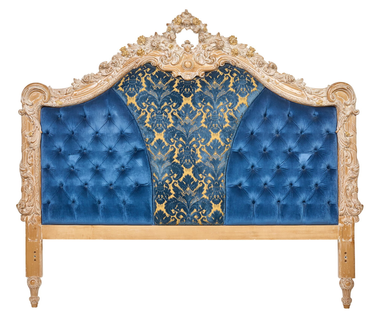 Tufted Blue Headboard: King size headboard, with ornate foliate motif carvings and button-tufted blue fabric upholstery height 75 in. x width 86 in. x depth 4 in. Provenance: Property from the Estate of Robert A.