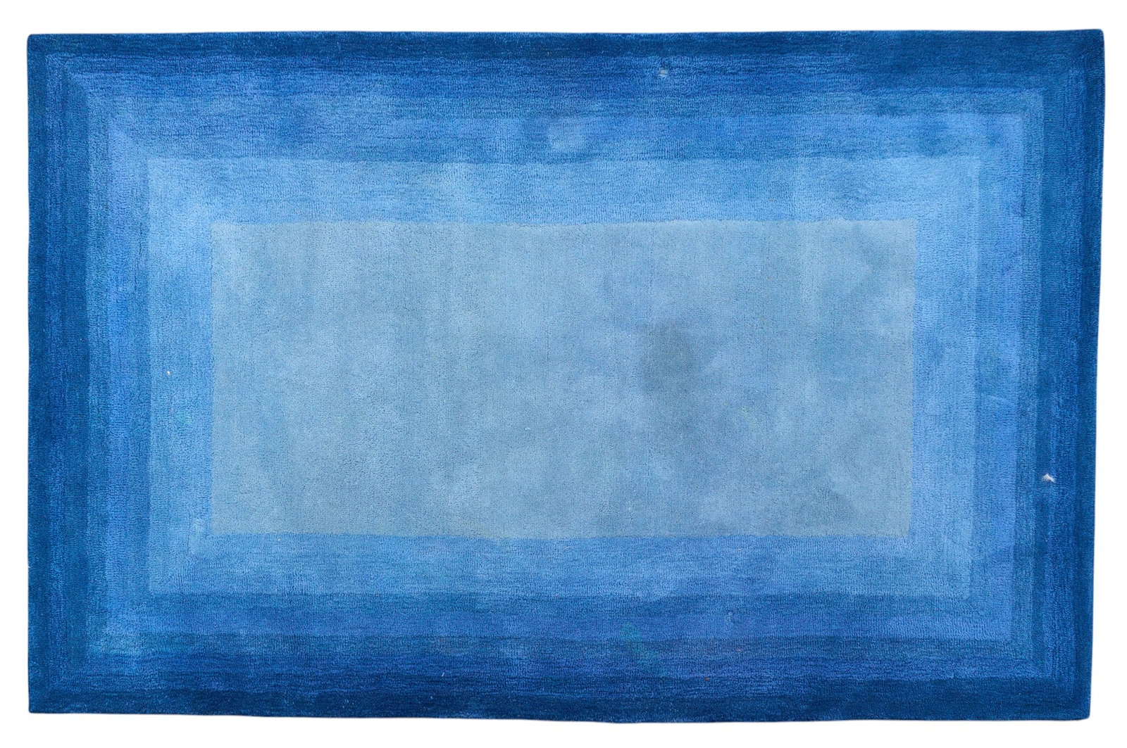 Blue Area Rug, 8 ft. 3 in. x 5 ft. 3 in.: Blue ombre rug 8 ft. 3 in. x 5 ft. 3 in. Provenance: Property from the Estate of Robert A. "Bob" Funk Sr. - trailblazing American businessman, philanthropist, and rancher, from