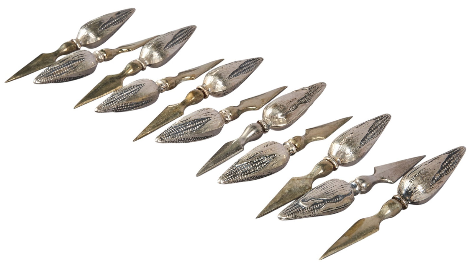(11) Sterling Silver Corn Holders: Set of eleven sterling silver corn holders, marked "Sterling" Length: 2.75 in. / each Total weight: 2.7 5ozt Pro
