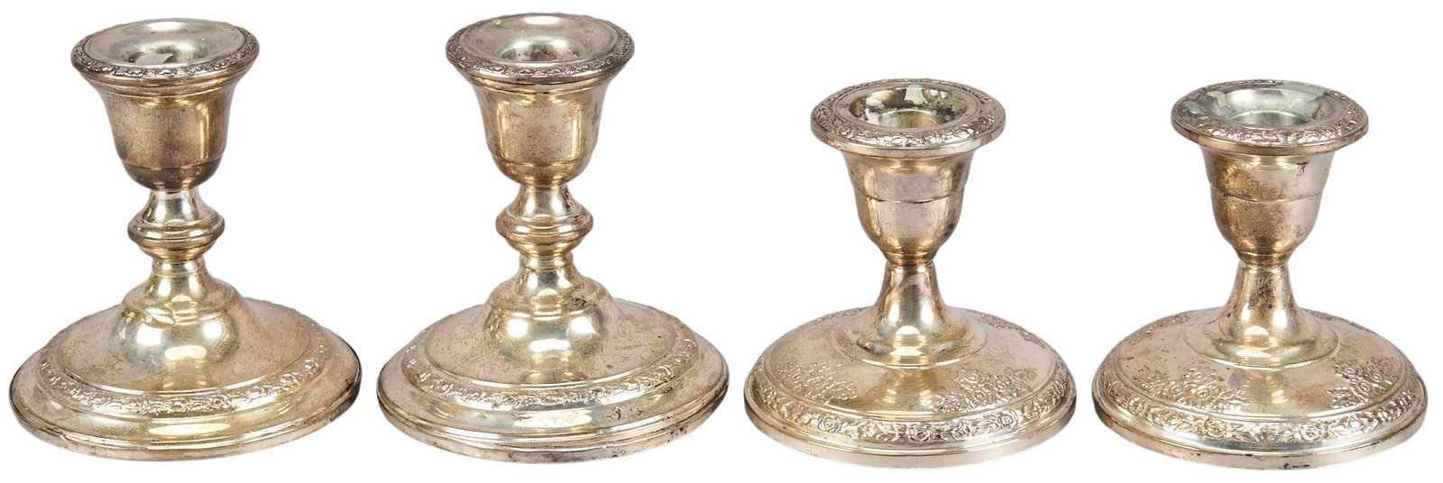 (4) Sterling Candelsticks: Two pairs of Frank and Whiting (Massachusetts) weighted sterling candlesticks, marked on bottom height 4.5 in. diameter 4.5 in. / each Total weight: 46.99 g Provenance: Property from