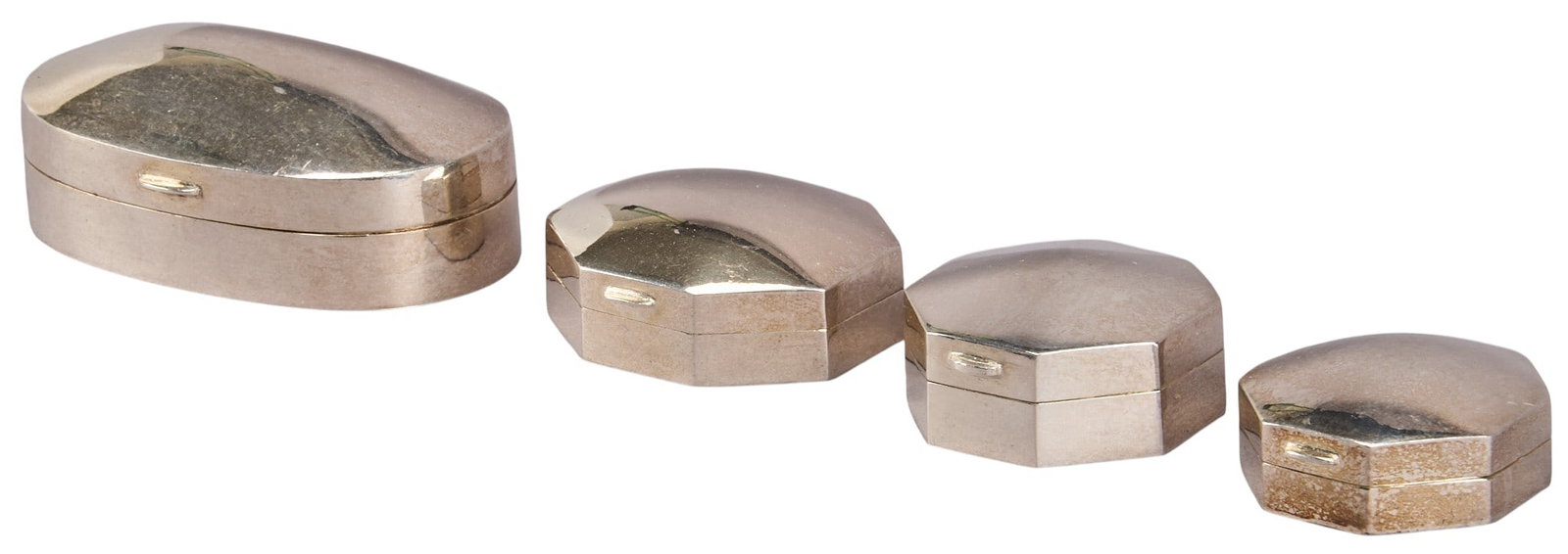 (4) Sterling Silver Pill Boxes: Four sterling silver pill boxes, each marked "925" Total weight: 3.82 ozt Provenance: Property from an estate collection at a home in the Lincoln Heights neighborhood of San Antonio,
