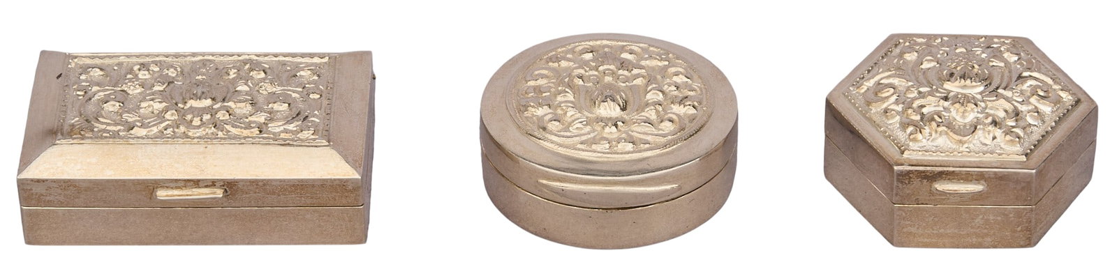 (3) Sterling Silver Repousse Pill Boxes: Three sterling silver repousse pill boxes, marked "925" Total weight: 2.53 ozt Provenance: Property from an estate collection at a home in the Lincoln Heights neighborhood of San