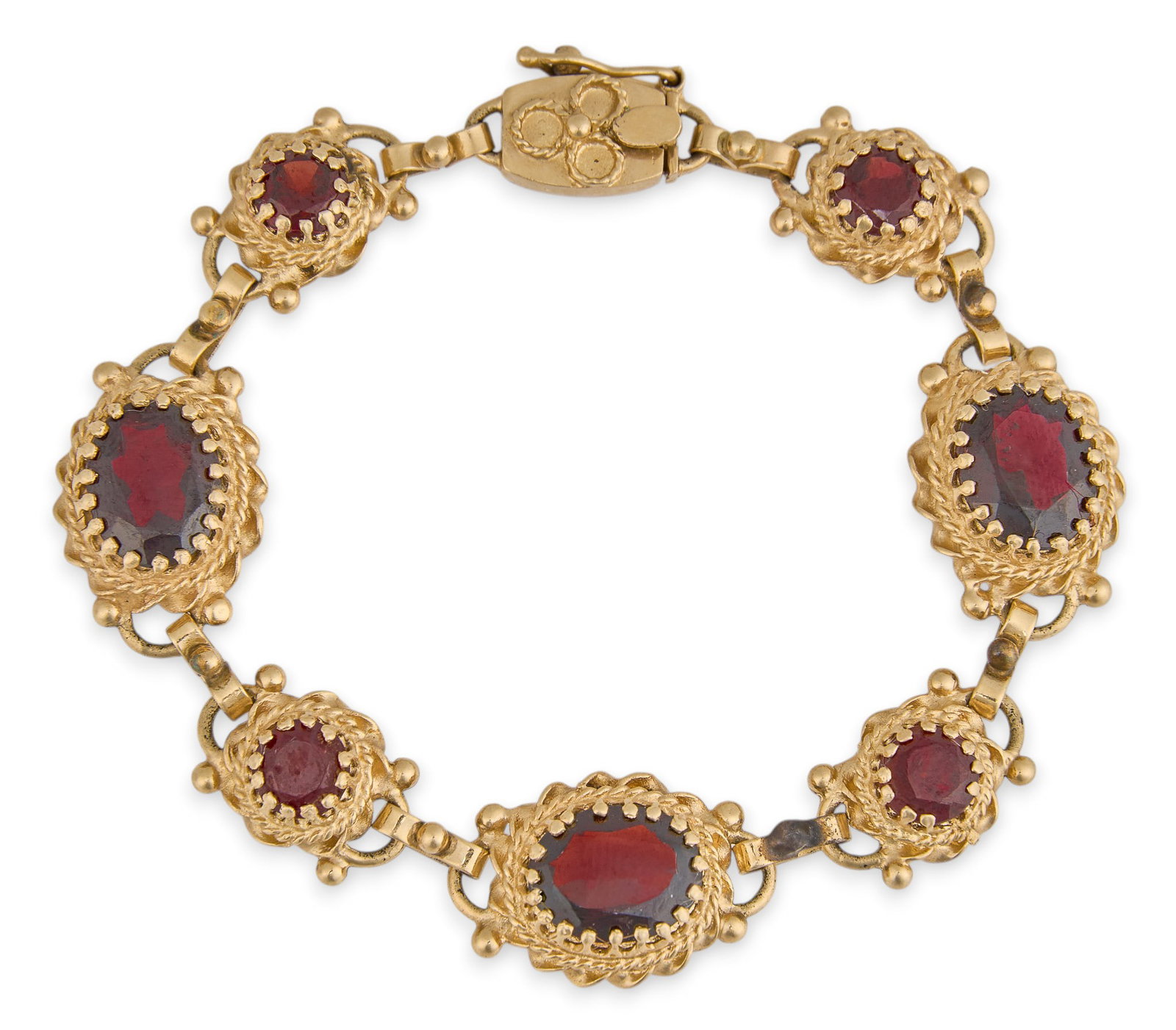 14K Garnet Gemstone Bracelet: 14K yellow gold bracelet, set with round and oval cut garnet, in ornate settings, marked "14K" to clasp Length: 6.5 in. Total weight: 18.4 g Provenance: Property from an estate